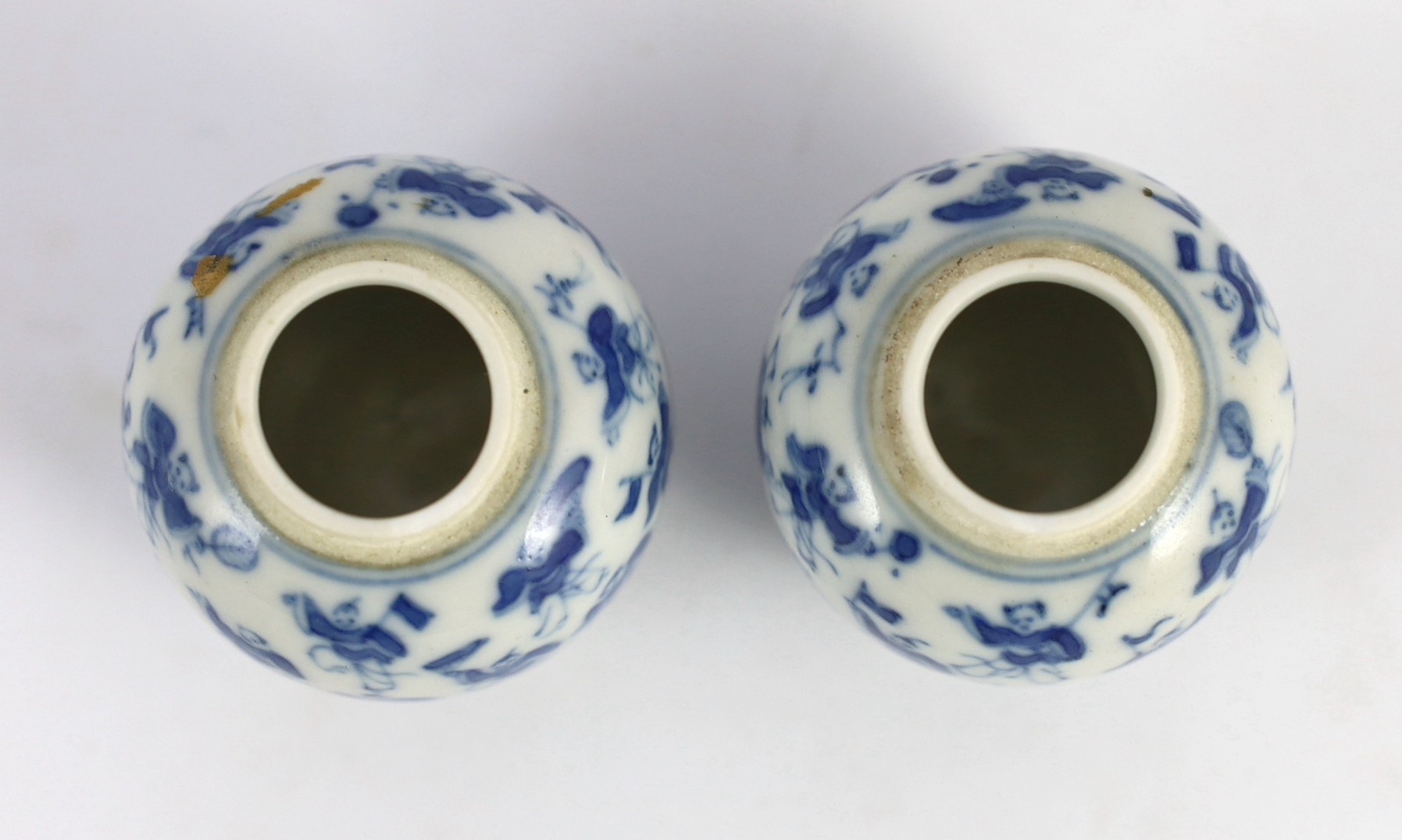 A pair of 19th century Chinese blue and white boys miniature jars and covers, 5.5 cm high